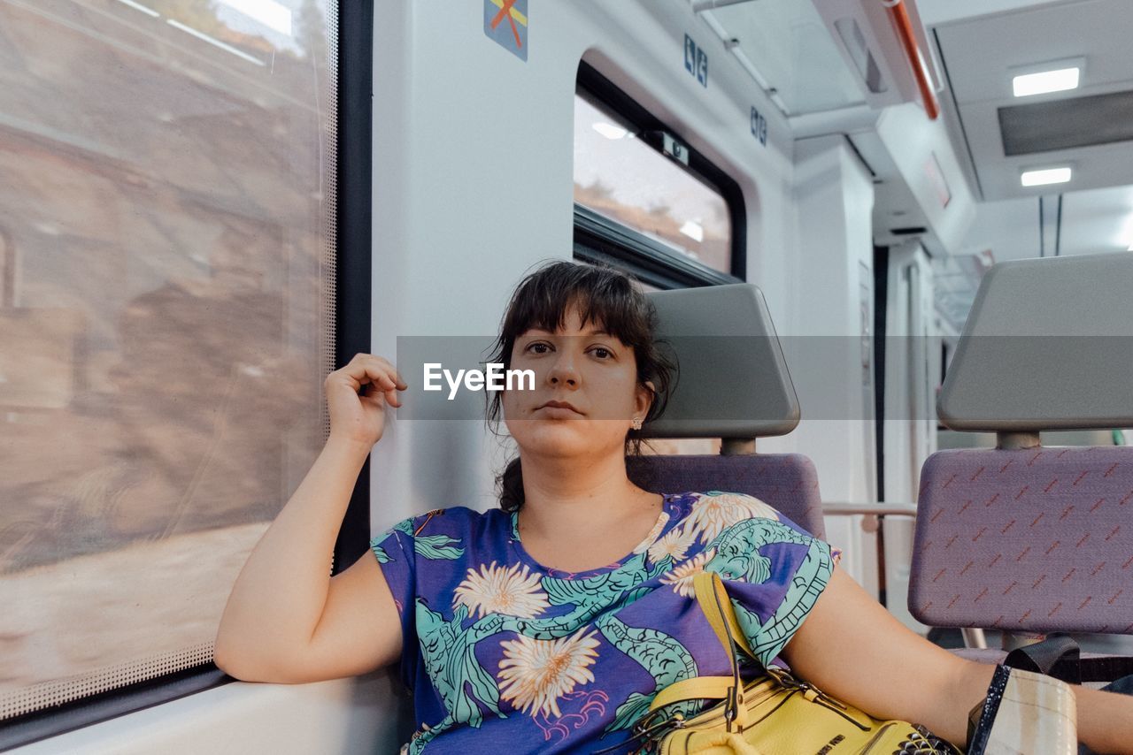 Young woman sitting in train