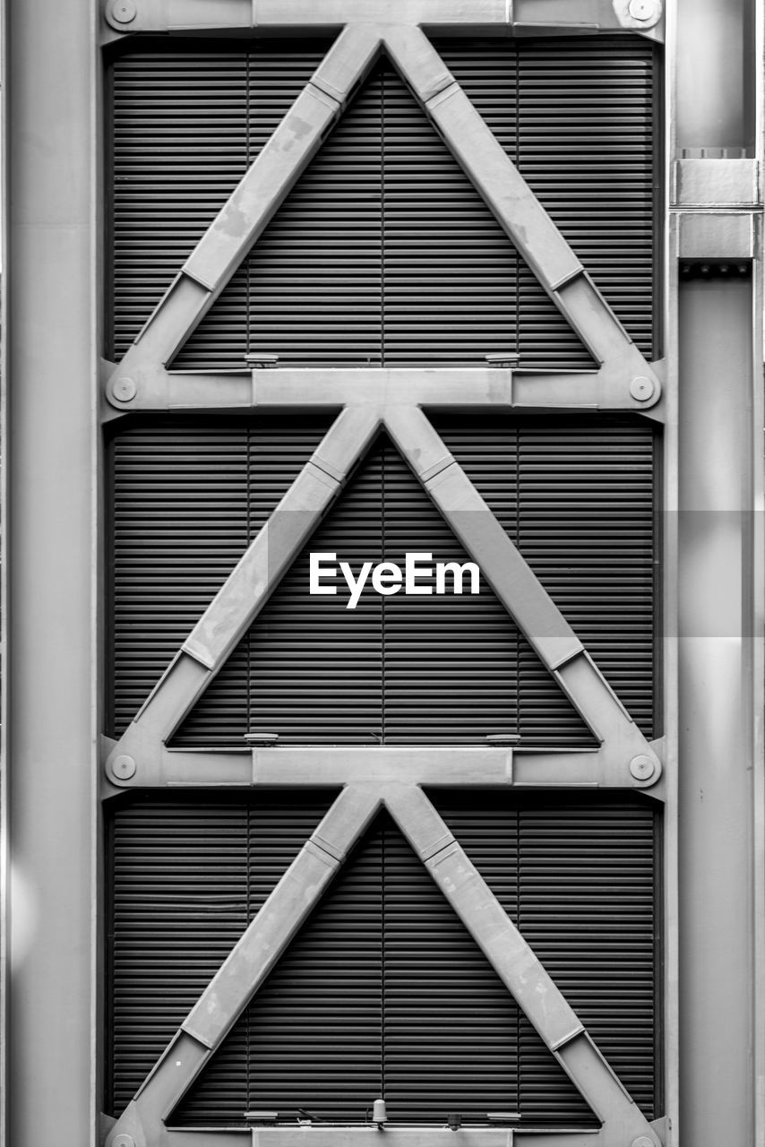 architecture, built structure, black and white, building exterior, closed, no people, metal, pattern, monochrome, shutter, monochrome photography, building, facade, shape, full frame, day, backgrounds, window, iron, interior design, white, security, geometric shape, line, triangle shape, outdoors, door, protection