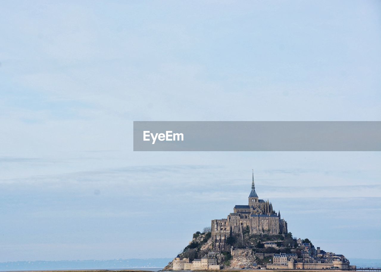 Historic mont saint-michel against sky