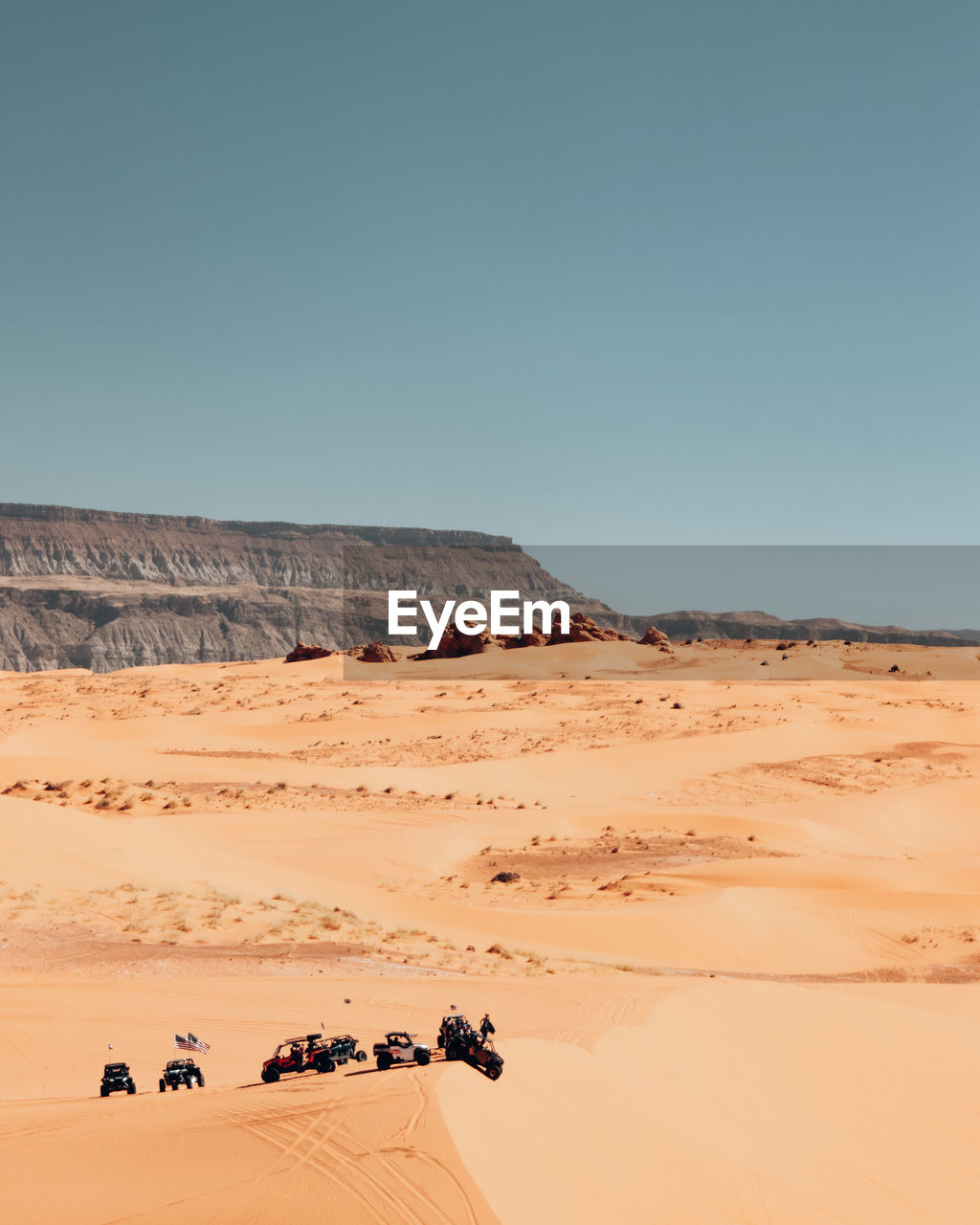 Scenic view of desert against clear sky