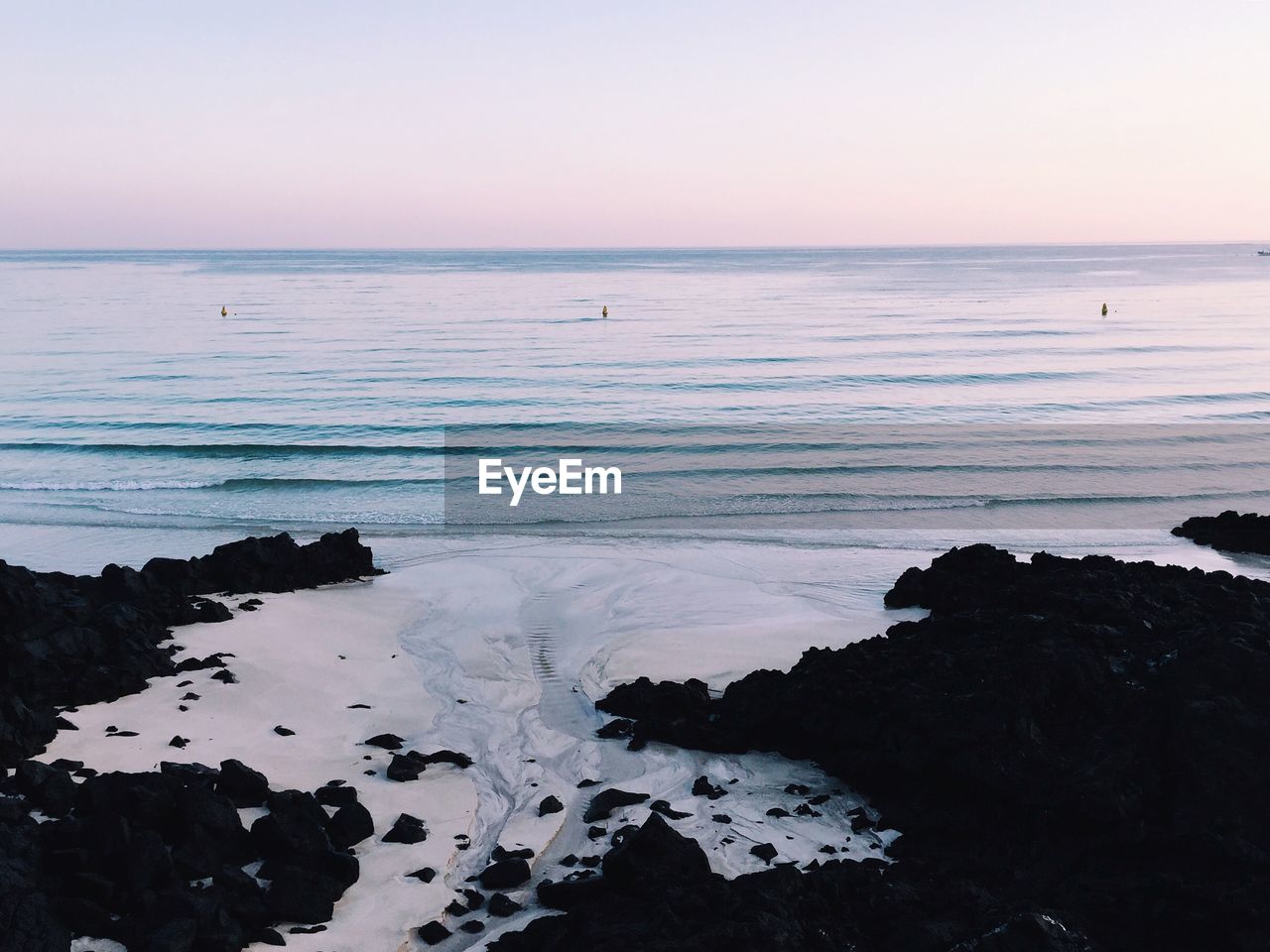 Idyllic shot of sea against sky at hamdeok beach