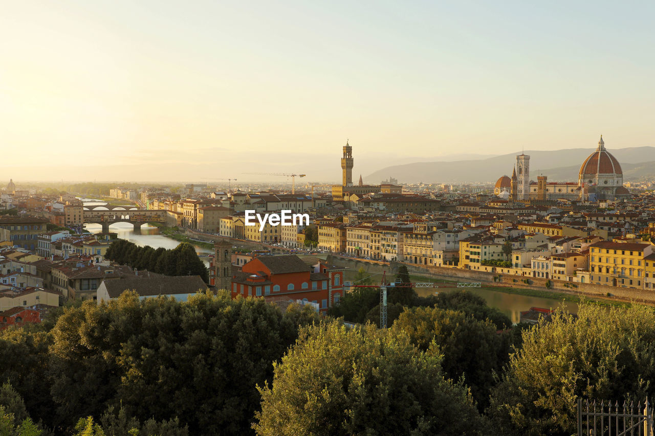 River arno with palazzo vecchio palace and cathedral of santa maria del fiore, florence, italy