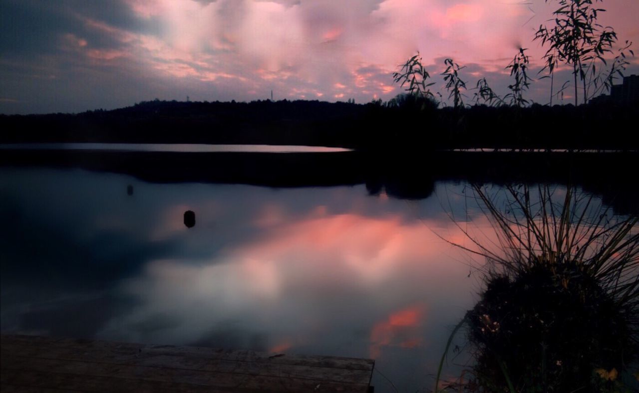 SCENIC VIEW OF LAKE AGAINST DRAMATIC SKY