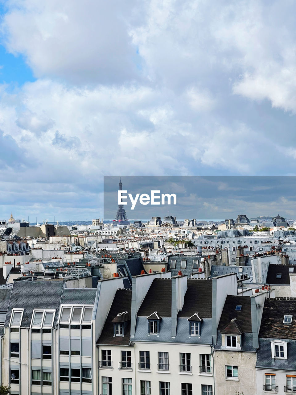 High angle view of buildings in city against sky paris