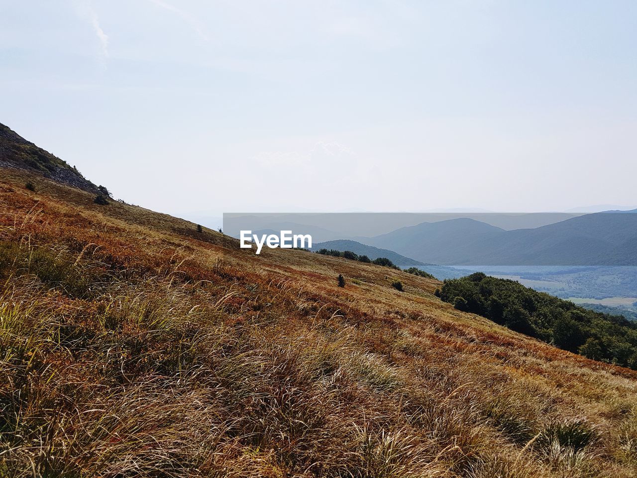 SCENIC VIEW OF LANDSCAPE AND MOUNTAINS AGAINST SKY