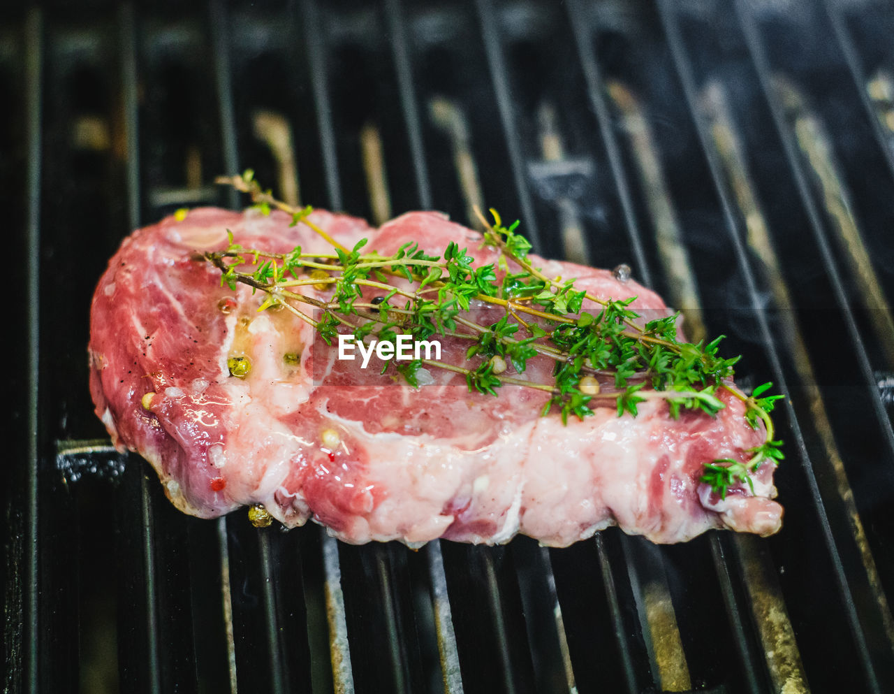 CLOSE-UP OF MEAT ON BARBECUE