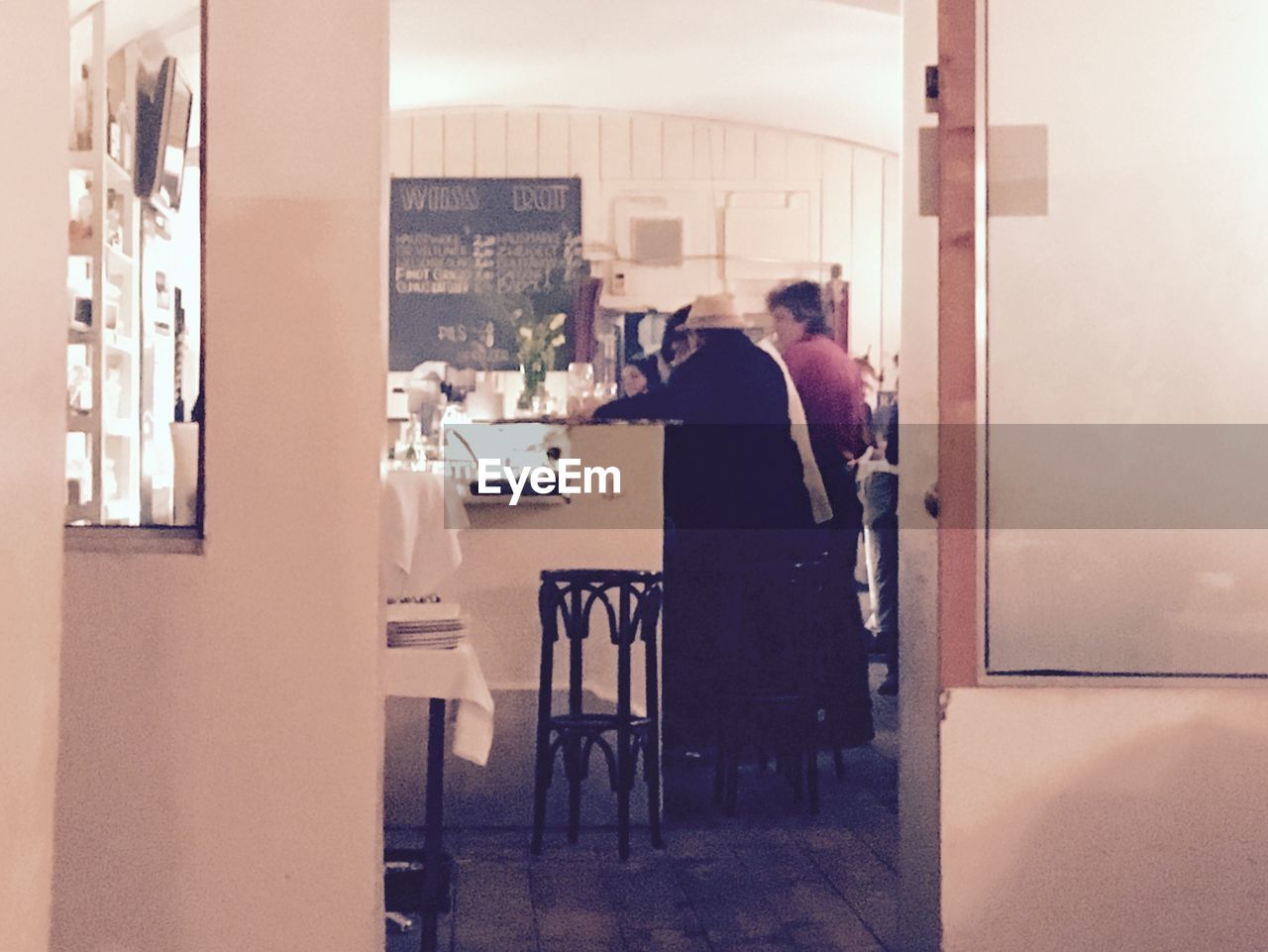 MAN AND TABLES AT CAFE