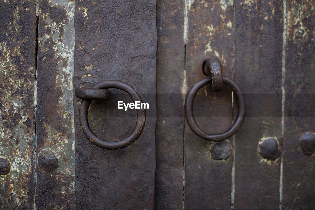 Close-up of metallic door knockers