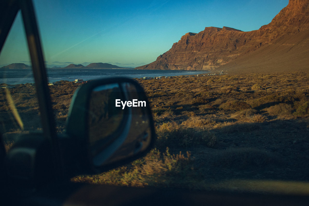 Reflection of road against sky during sunset