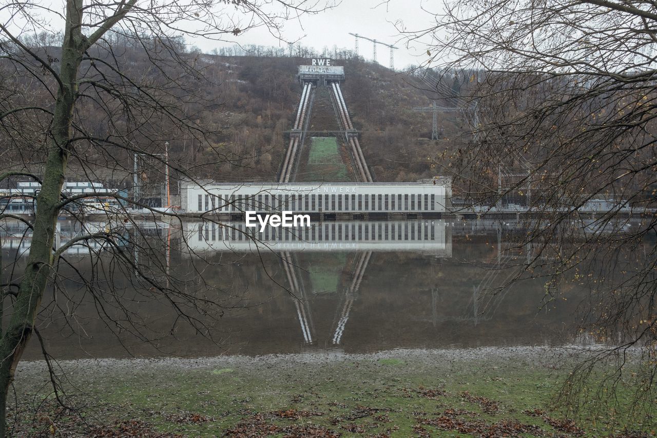 bare tree, tree, plant, architecture, built structure, nature, bridge, no people, water, day, outdoors, land, branch, park, sky, tranquility, park - man made space, growth, building exterior