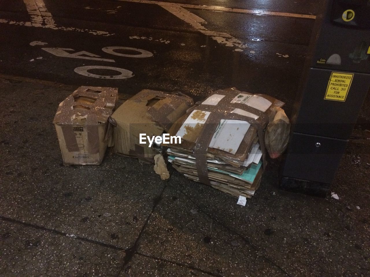 High angle view of cardboard on road at night