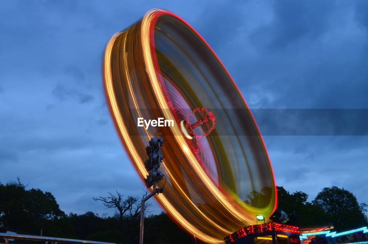 Low angle view of ferris wheel against sky