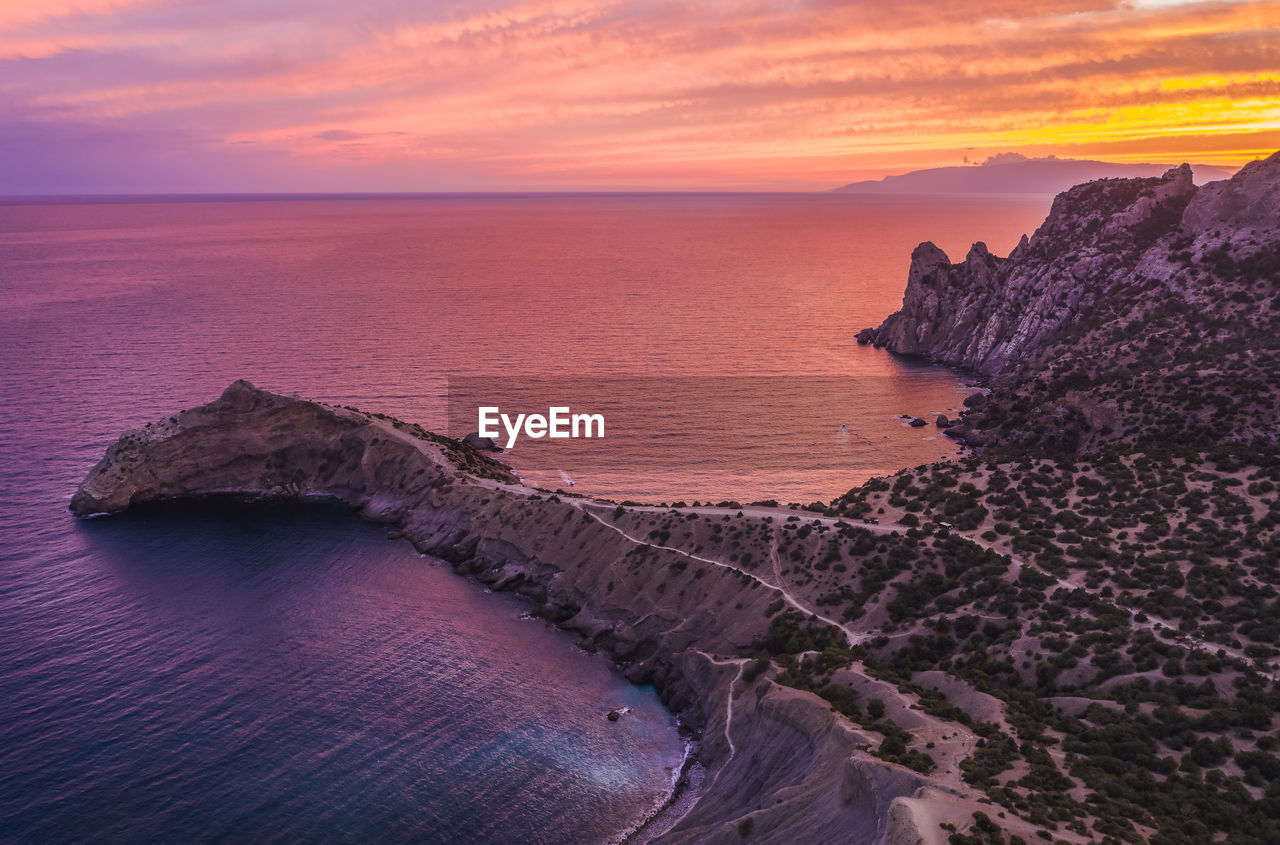 Novyi svit, crimea, sudak. aerial view of cape kapchik during beautiful sunset. black sea