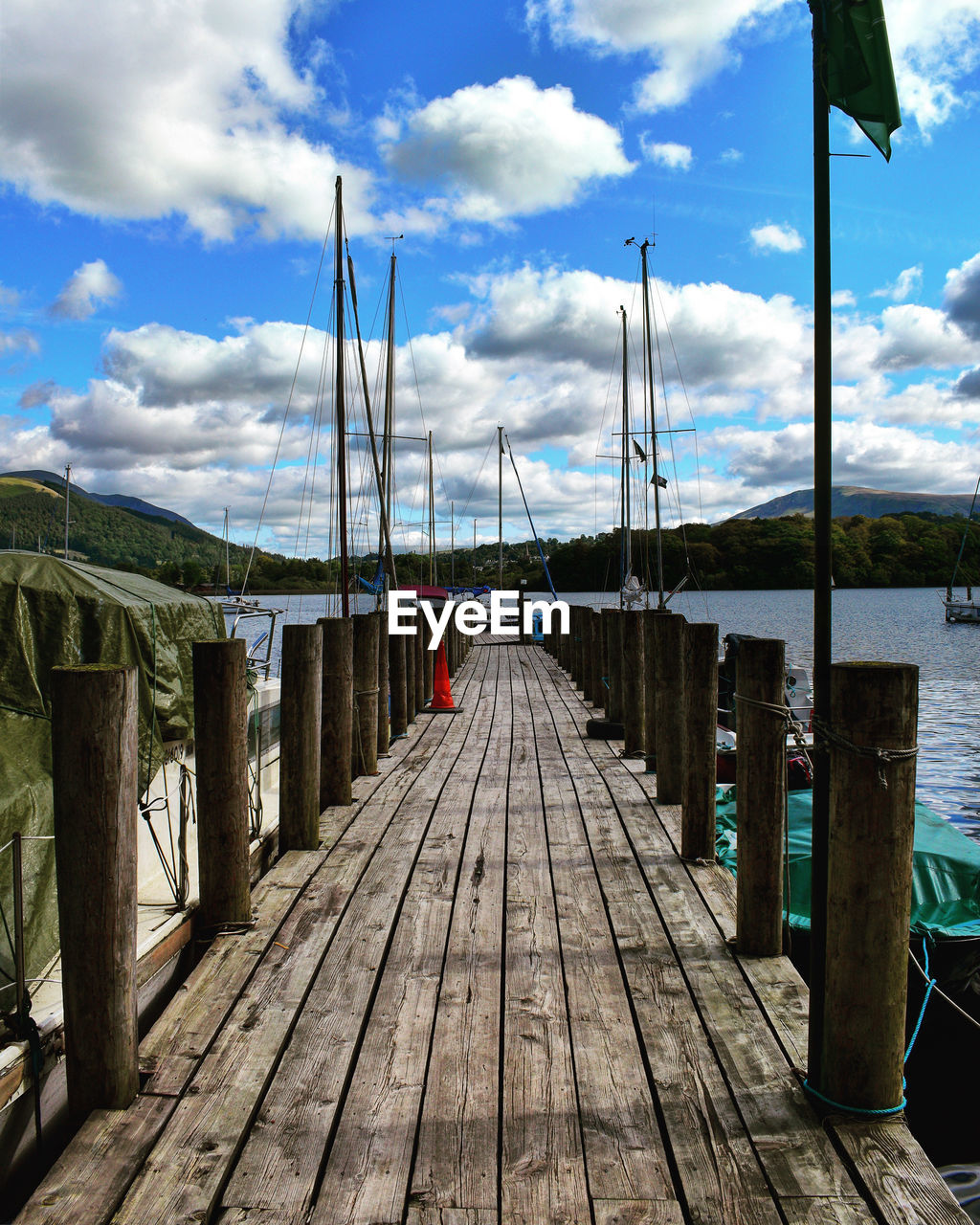 WOODEN PIER LEADING TOWARDS SEA