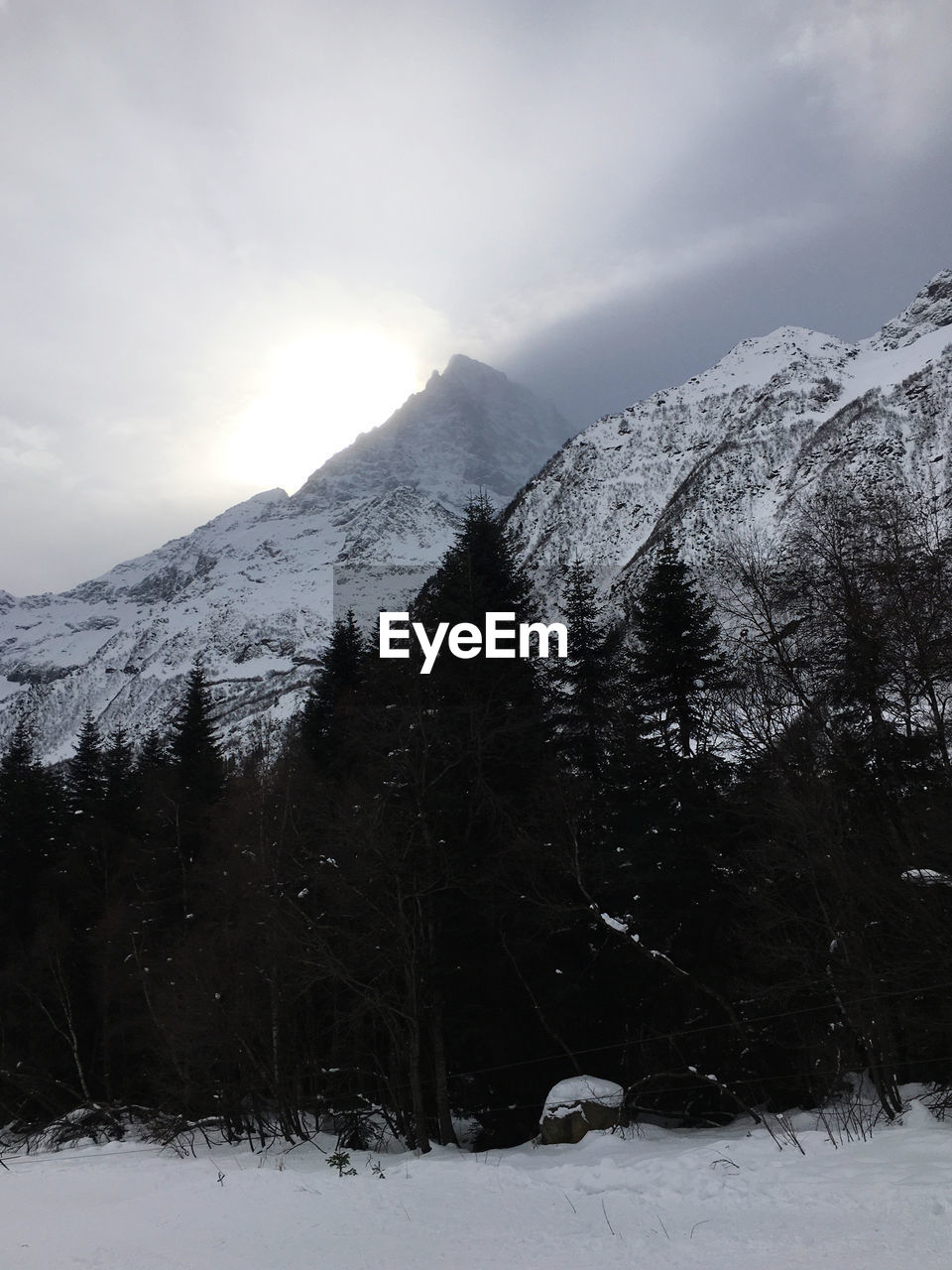 SCENIC VIEW OF SNOWCAPPED MOUNTAINS DURING WINTER