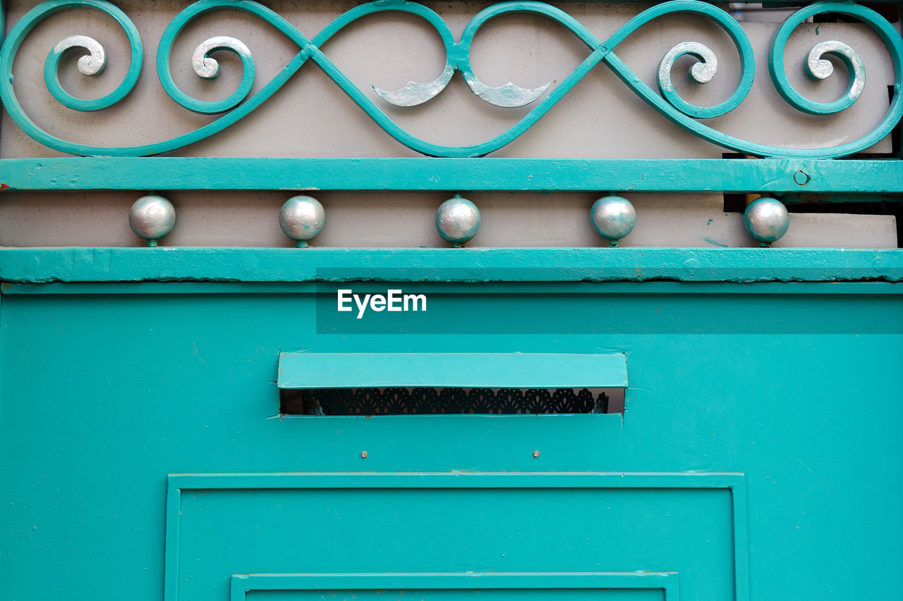 Detail of iron gates with decorative elements different shapes, close-up.