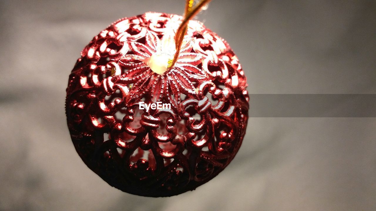 Close-up of christmas ornament against wall