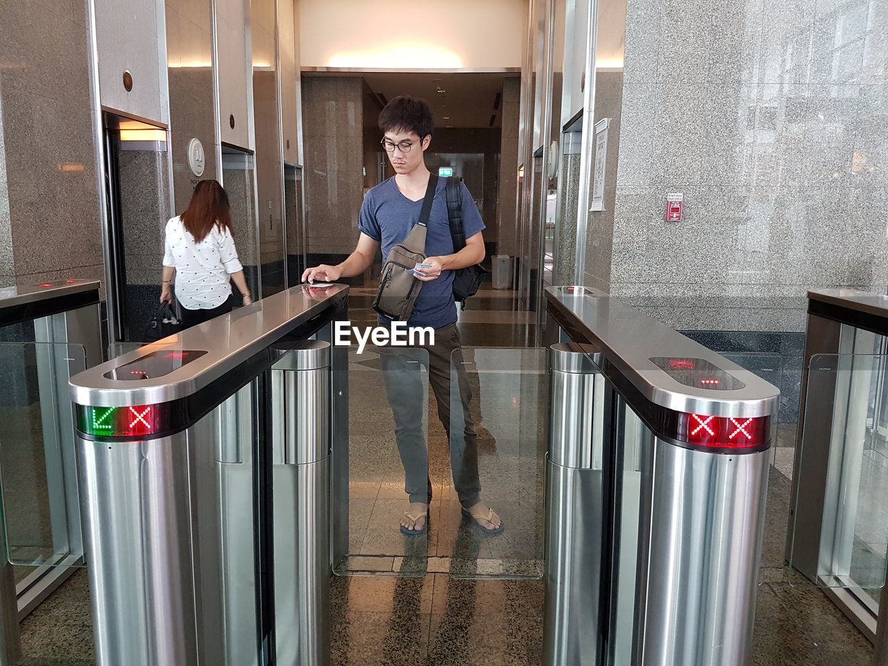 Man standing at turnstile