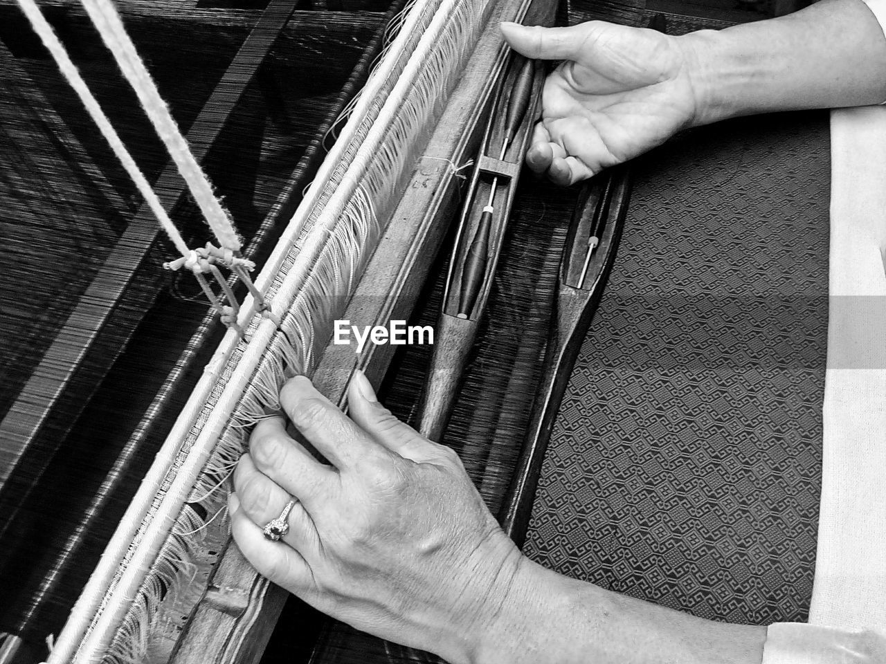 Close-up of person hand working at textile industry