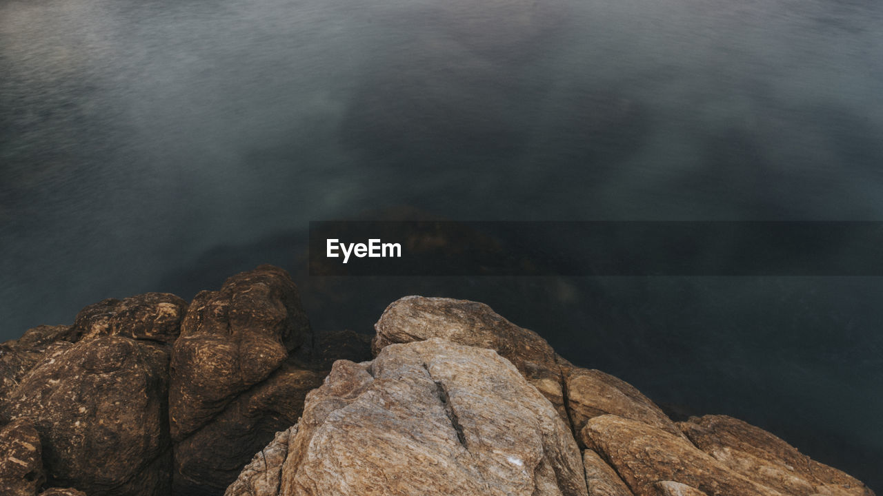 High angle view of rock formation in sea