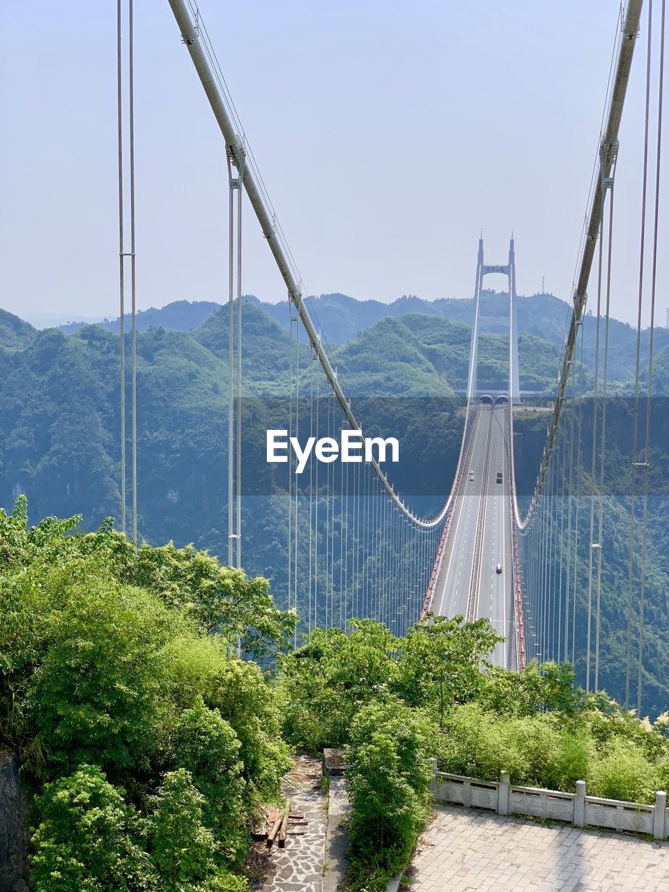 Panoramic view of suspension bridge against sky
