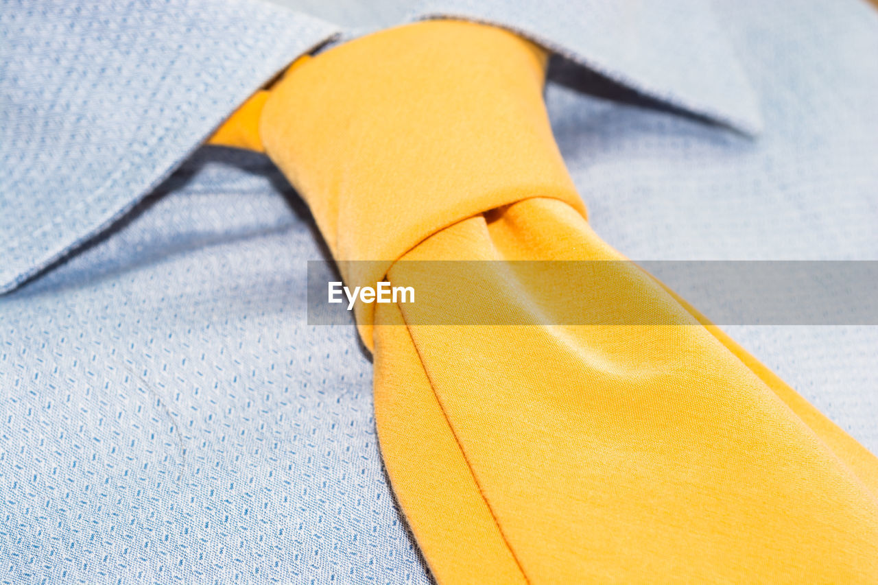 Close-up of yellow tie