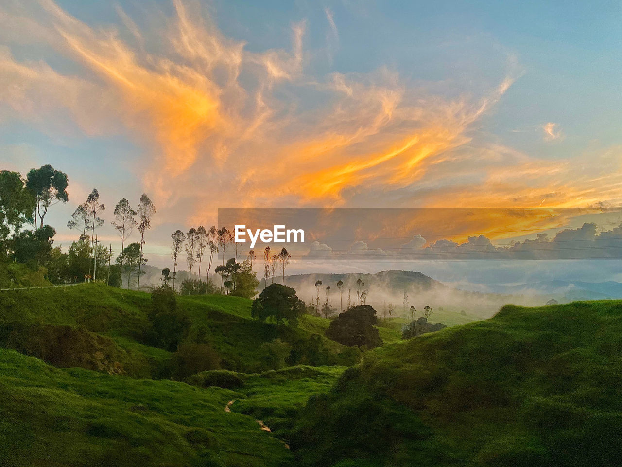 Scenic view of landscape against sky during sunset