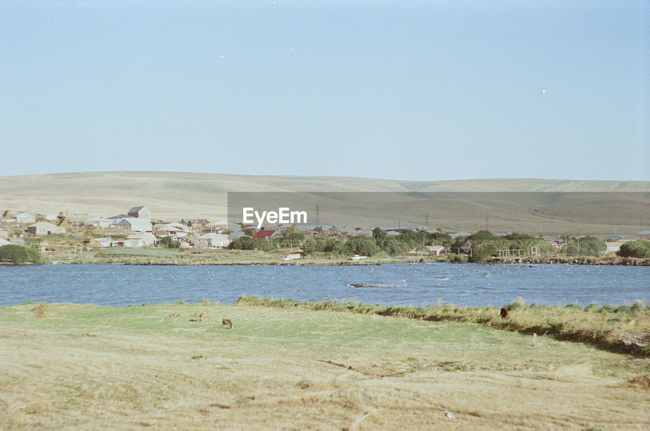 Scenic view of beach against clear sky