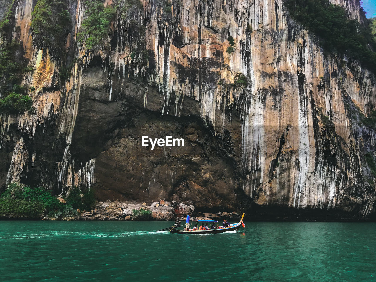 Scenic view of sea against rock formation