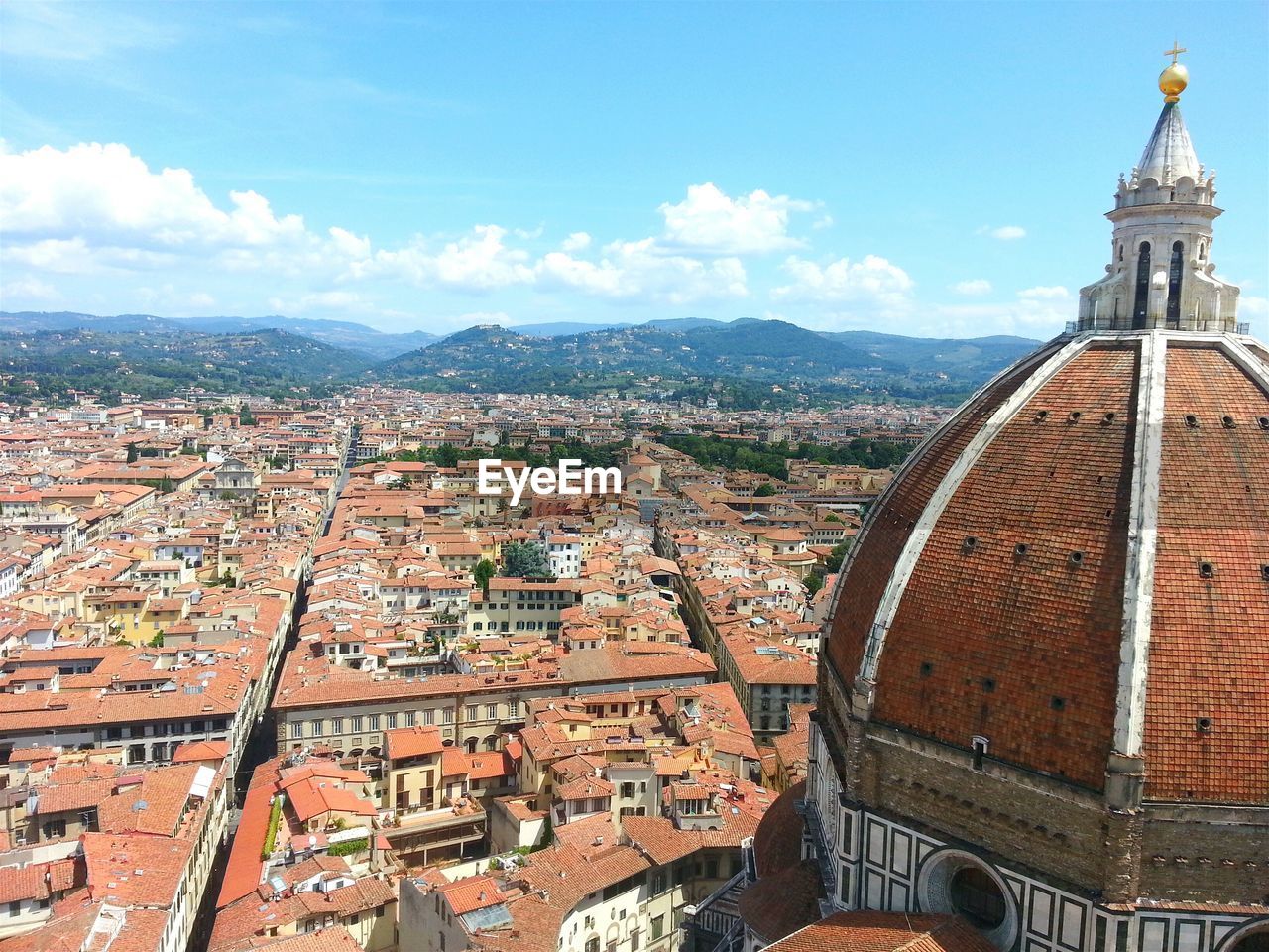 Dome of cattedrale di santa maria del fiore by cityscape against sky