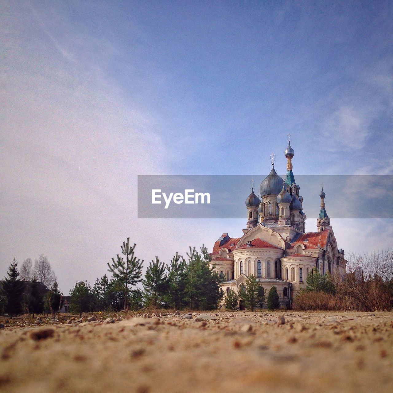 CHURCH AGAINST CLOUDY SKY