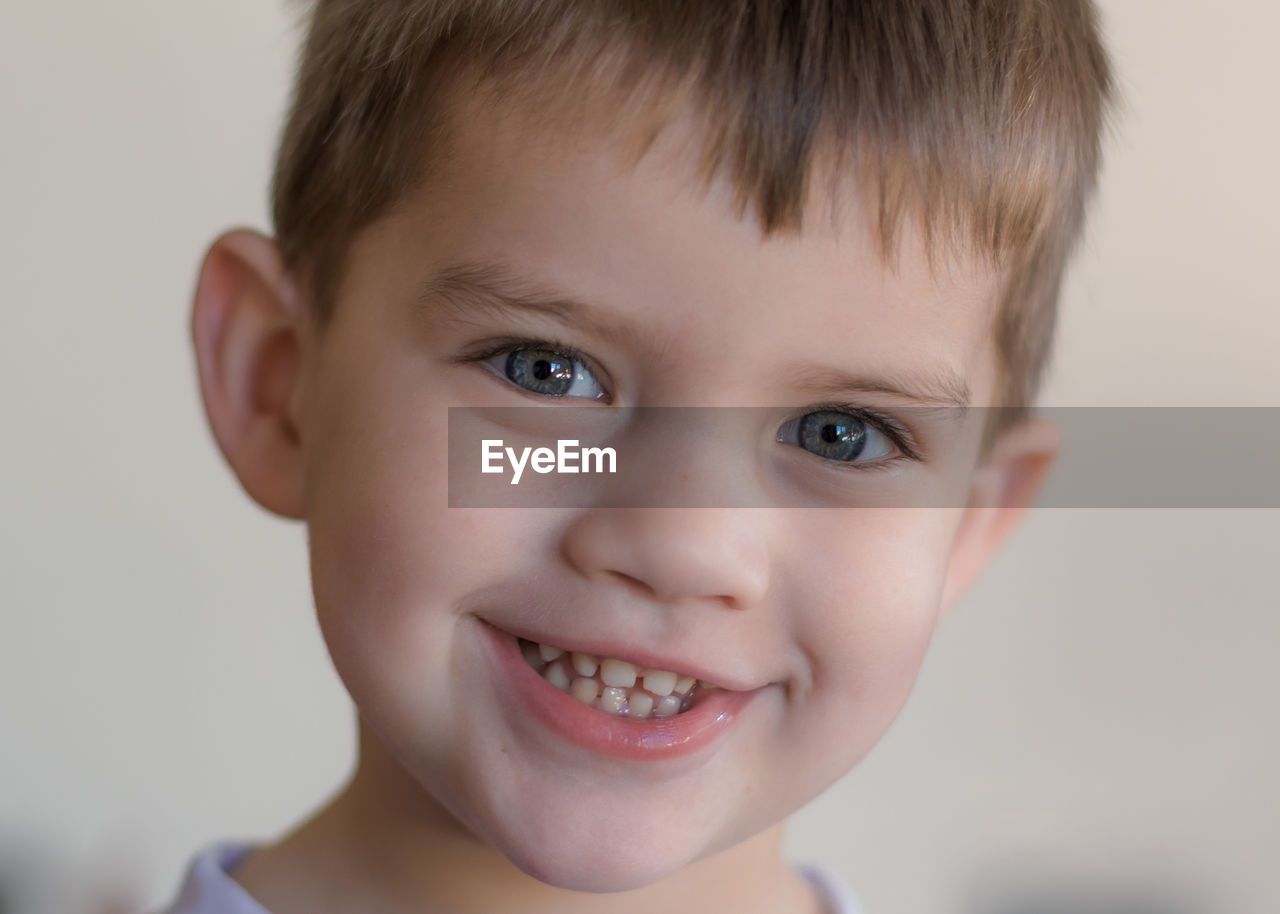 Close-up portrait of smiling boy