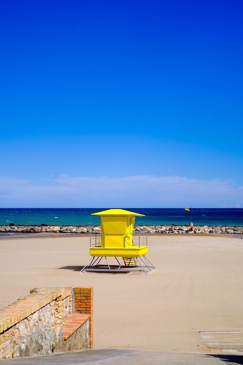 Scenic view of sea against blue sky