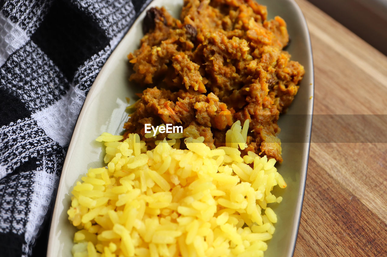 food and drink, food, dish, meal, freshness, cuisine, produce, healthy eating, wellbeing, indoors, rice - food staple, no people, high angle view, breakfast, curry, table, vegetable, close-up, asian food, indian food, still life, yellow, plate