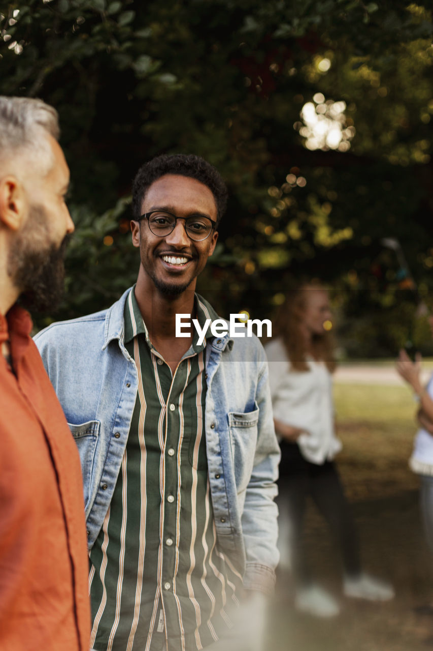 Smiling man in park looking at camera