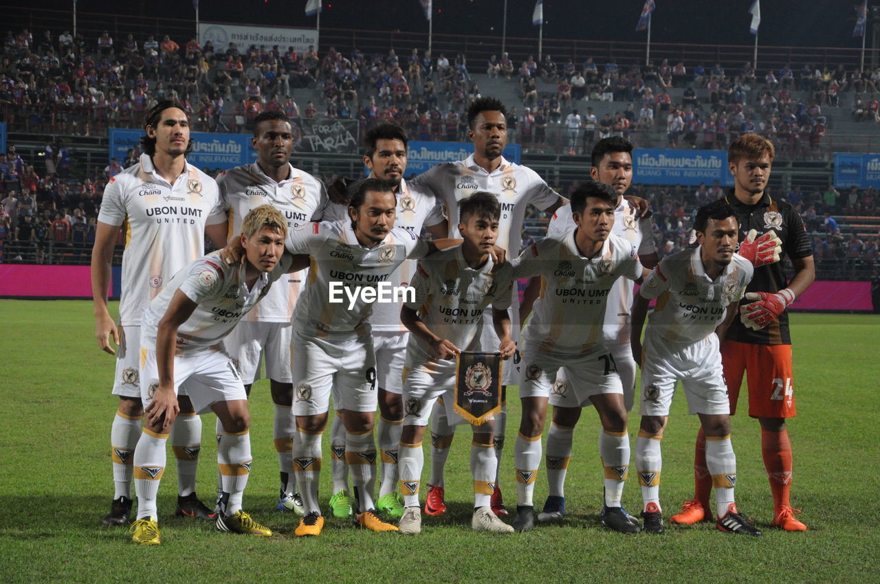 GROUP OF PEOPLE PLAYING SOCCER