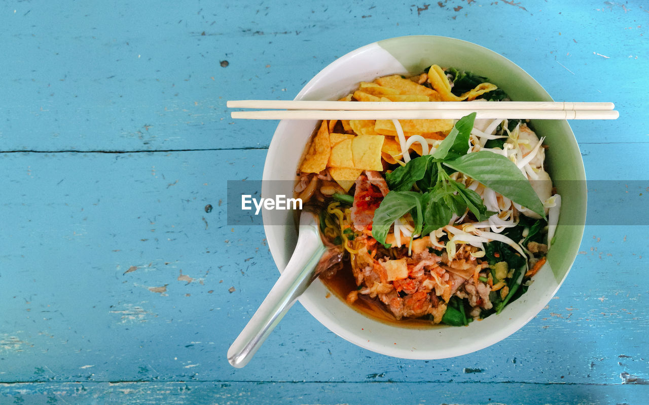 Directly above shot of food in bowl on table, street food, thai noodles.