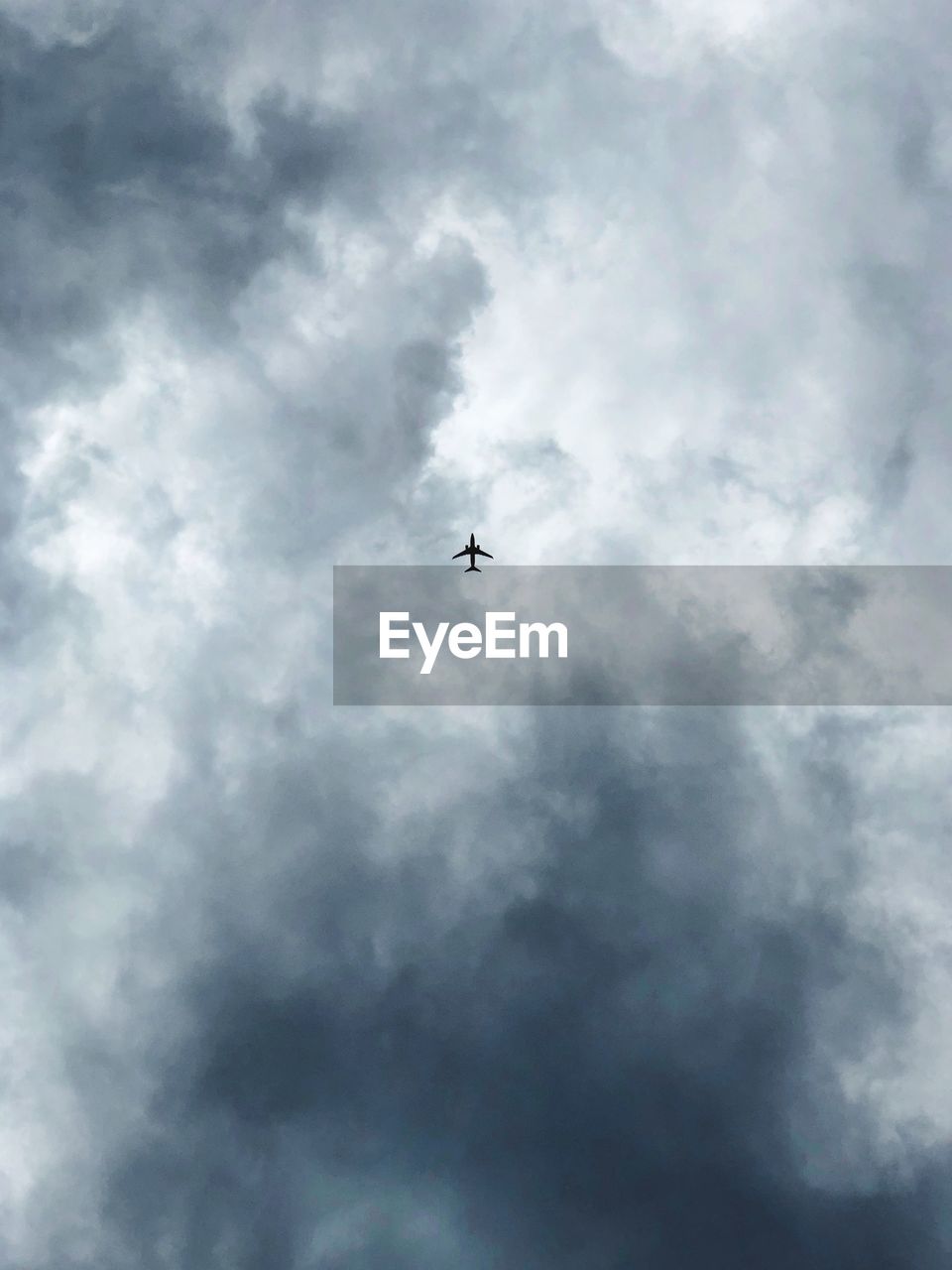 Low angle view of airplane flying in sky