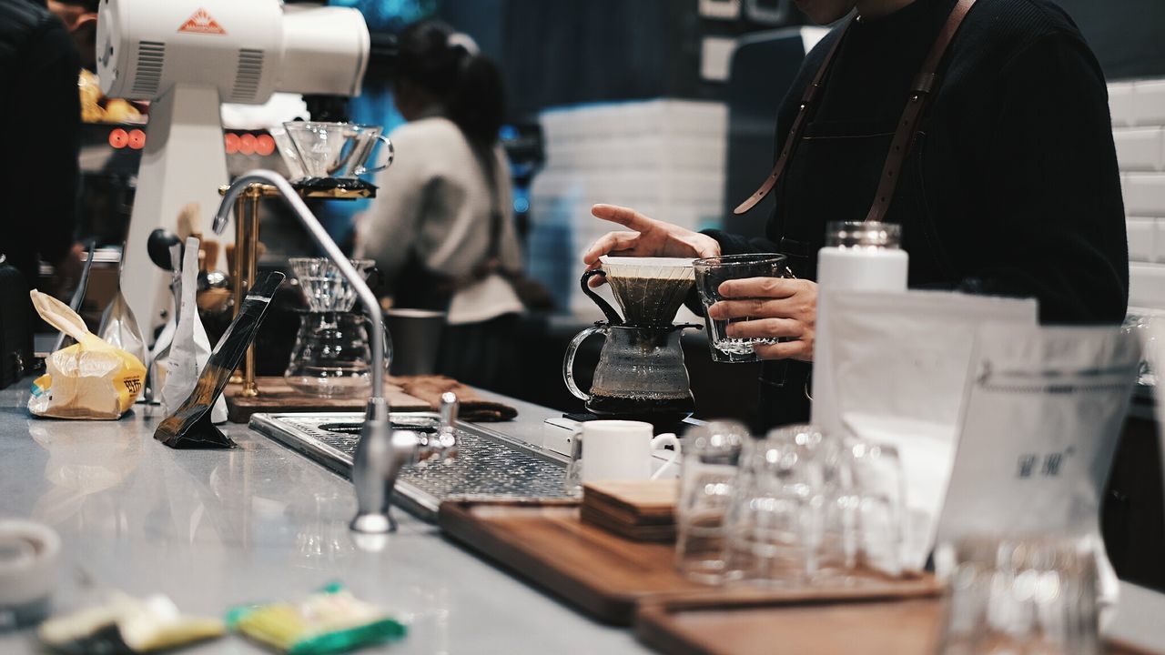 WOMAN WORKING IN GLASS