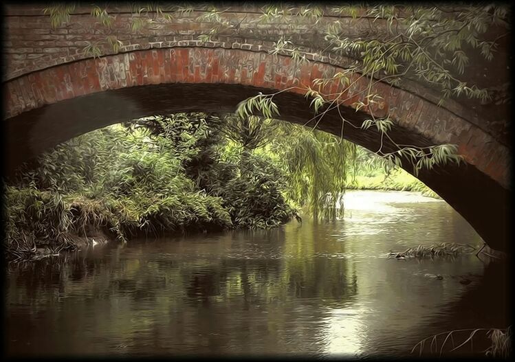 REFLECTION OF BRIDGE IN RIVER