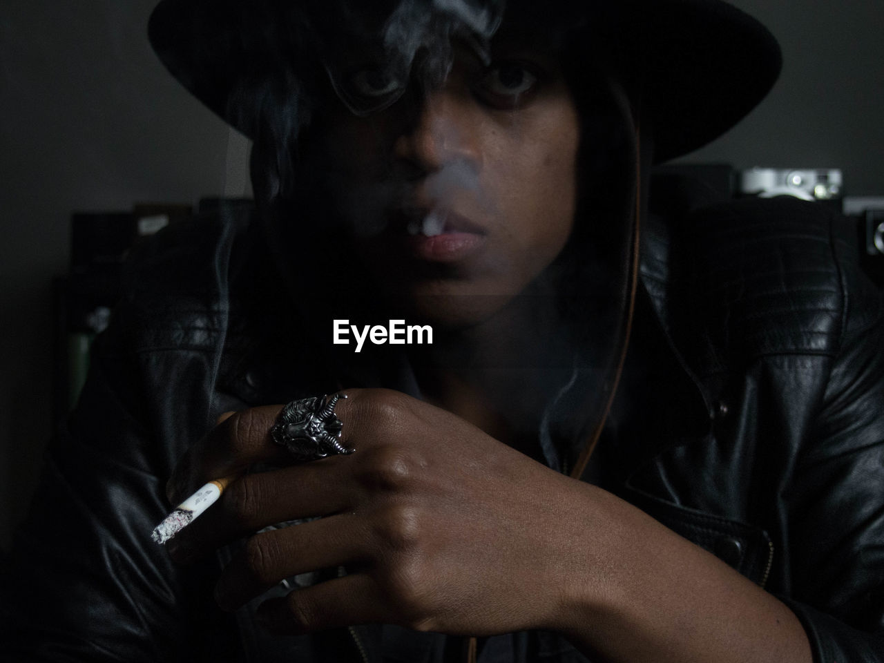 Close-up of young man smoking cigarette