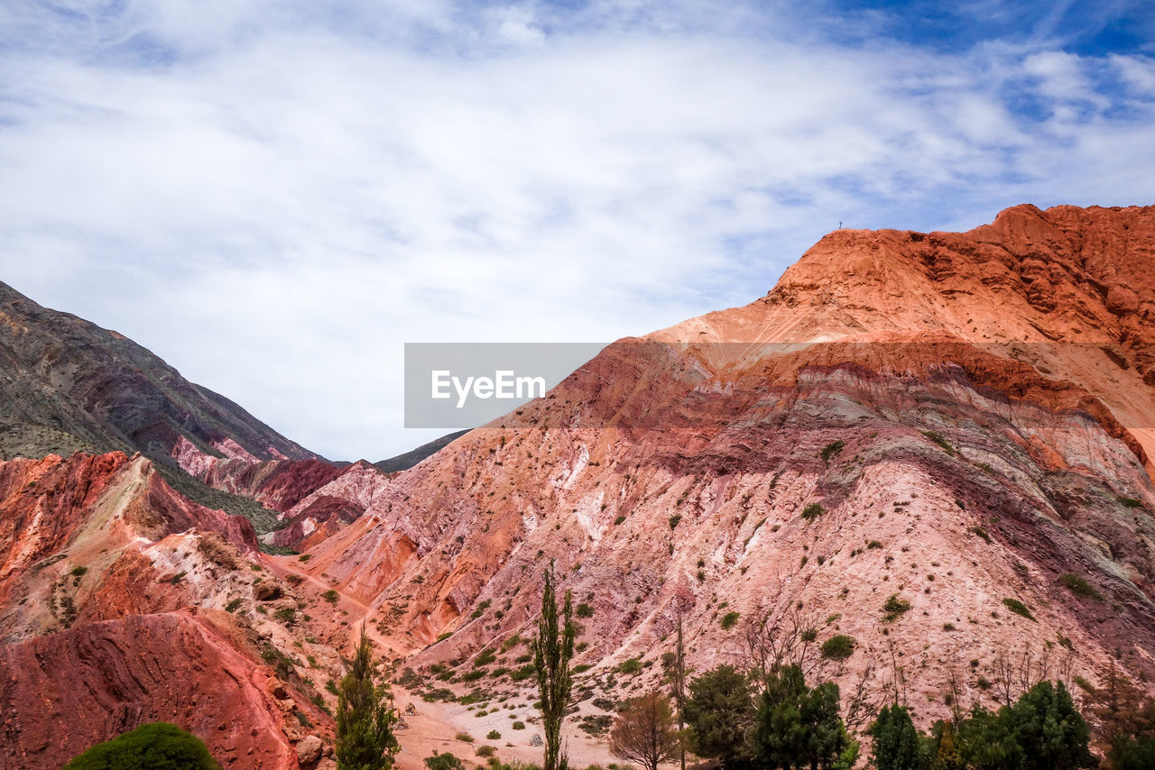 LOW ANGLE VIEW OF ROCKY MOUNTAIN AGAINST SKY