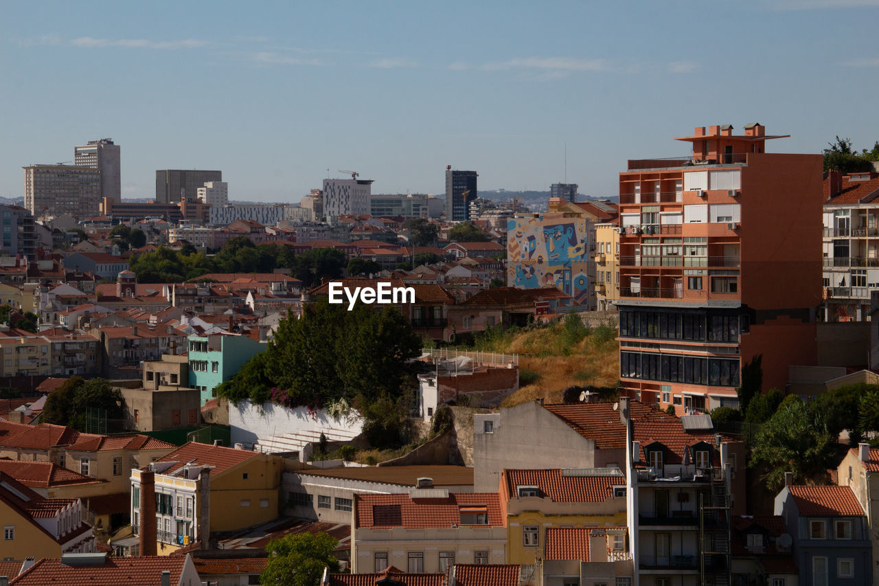 Buildings in lisbon against sky, view from a miradouro