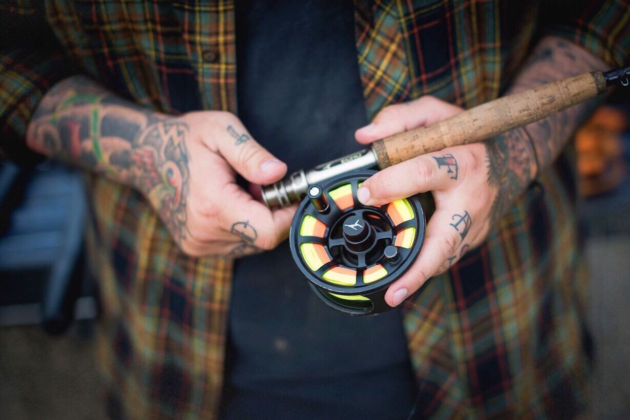 Close-up human hand holding fishing rod