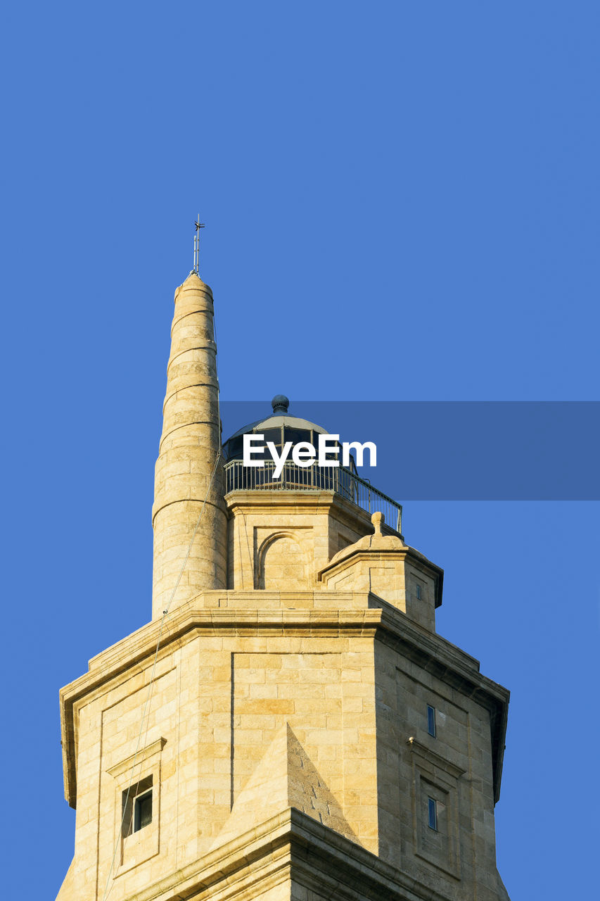 Tower of hercules against clear blue sky