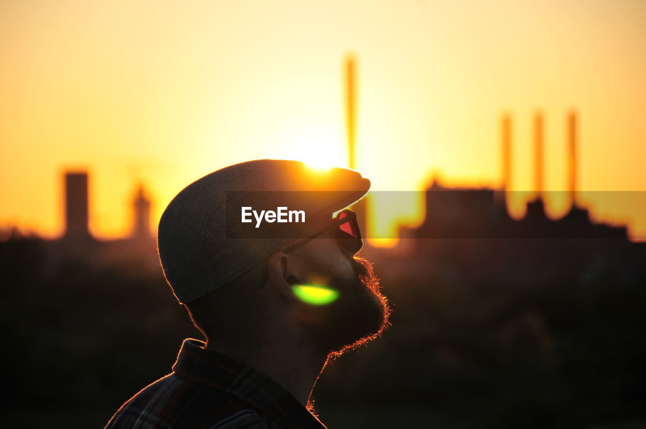 Young man enjoying the sunset. 