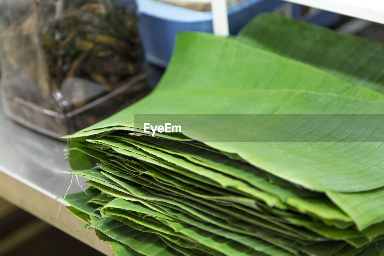 Close-up of a stack of banana leaves in an eatery