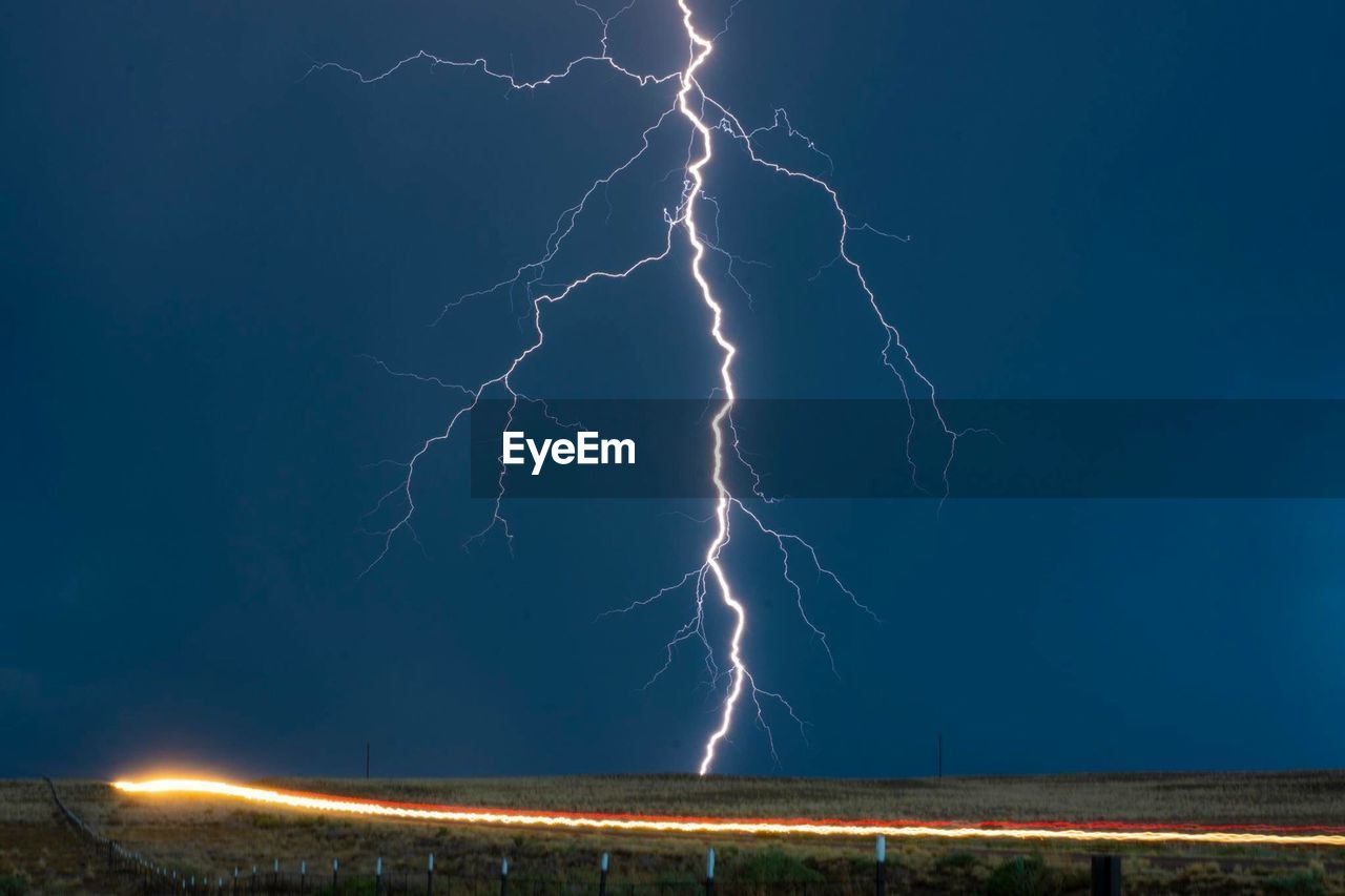 Forked lightning in sky at night