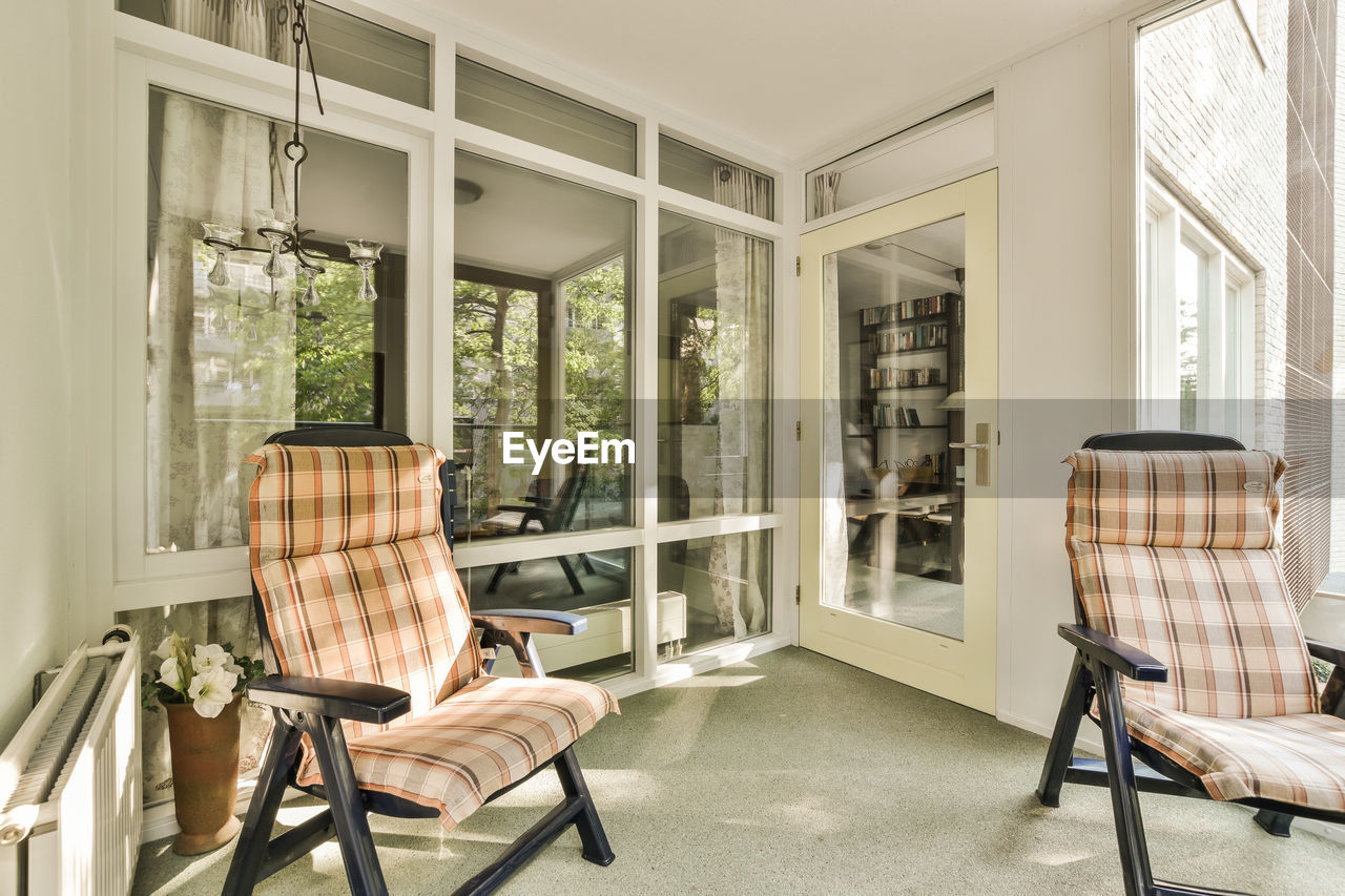 empty chairs and tables in living room