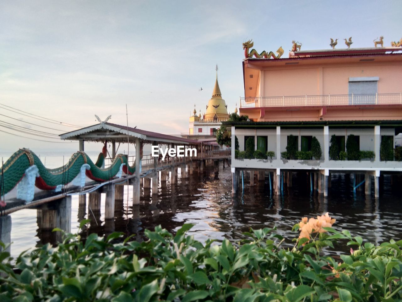 BRIDGE OVER RIVER BY BUILDINGS